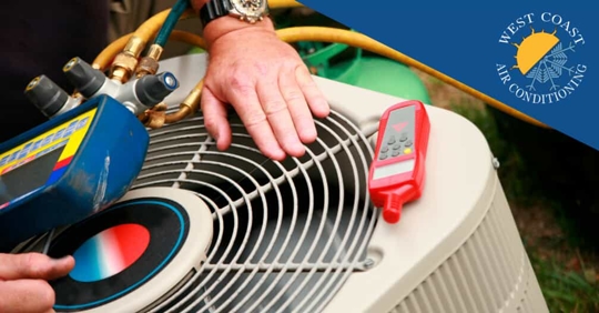 HVAC technician working on an air conditioner.