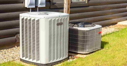air conditioning and heating system external units at the back of a house