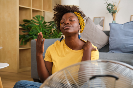 woman feeling the heat at home